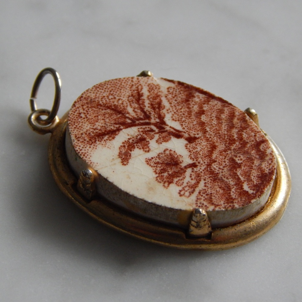 Stone pendant with tree design